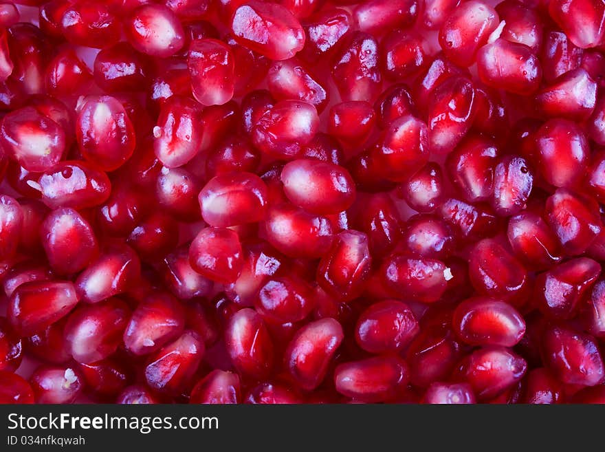 Background of pomegranate seeds full of vitamins