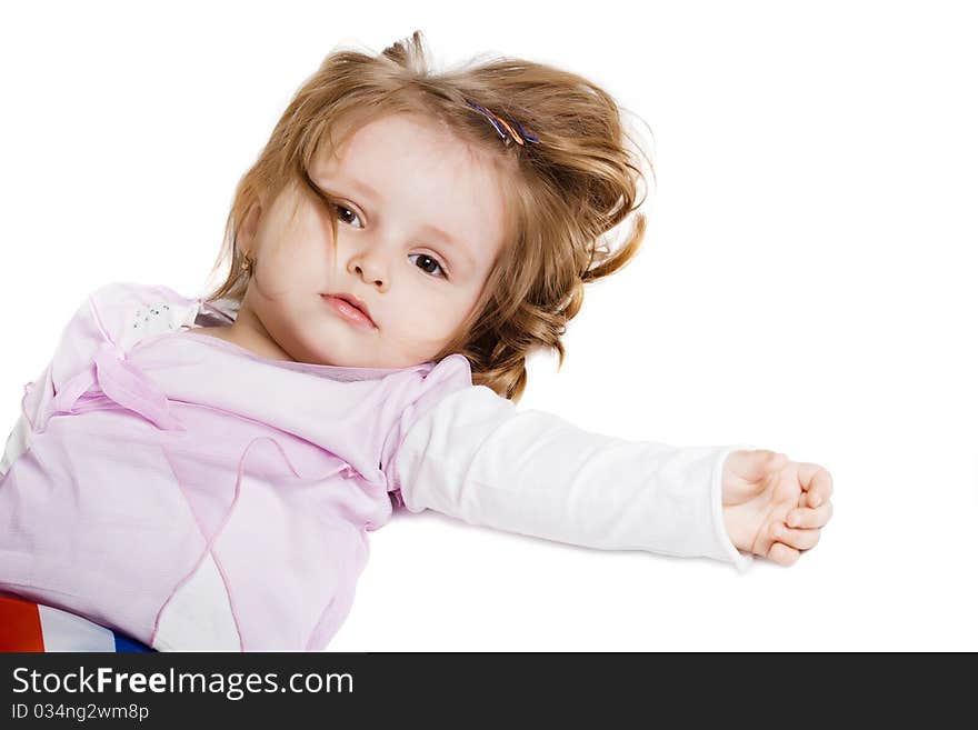 Little girl lying on the floor isolated