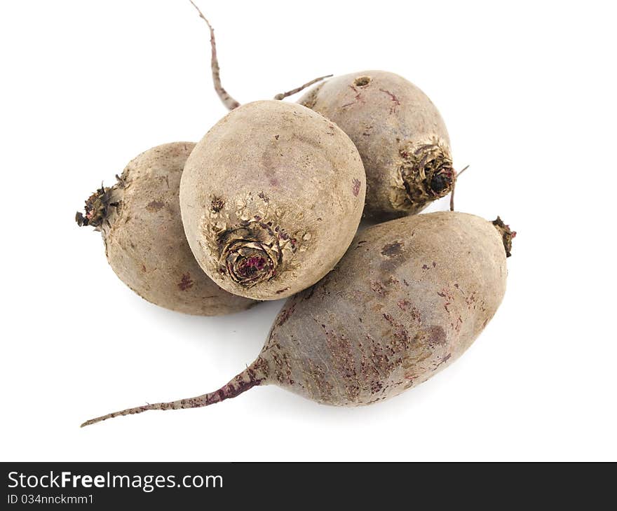 Four beets are located the friend on the friend create a heap on a white background. Four beets are located the friend on the friend create a heap on a white background