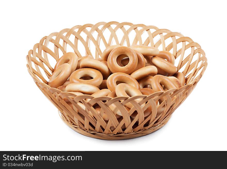 A heap of ring-shaped bread in the basket. A heap of ring-shaped bread in the basket