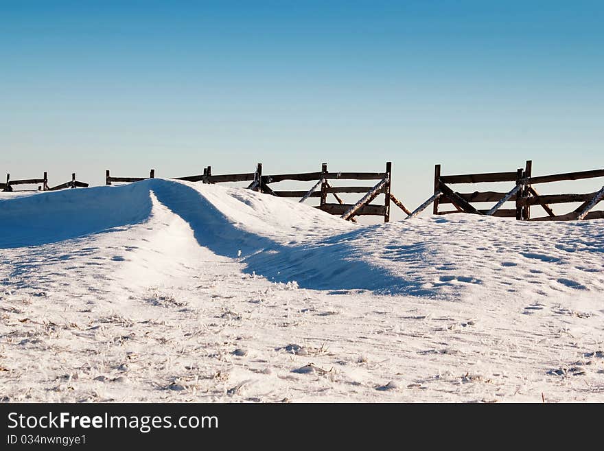 Snow background with wave and snowdrift with blue sky