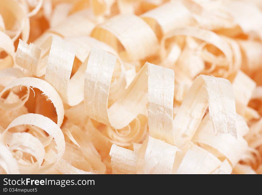 Wooden shaving texture. Macro view of spiral shavings.