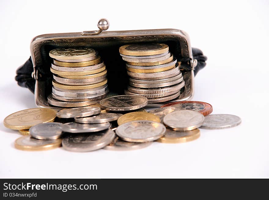 Purse with coins on white isolated background