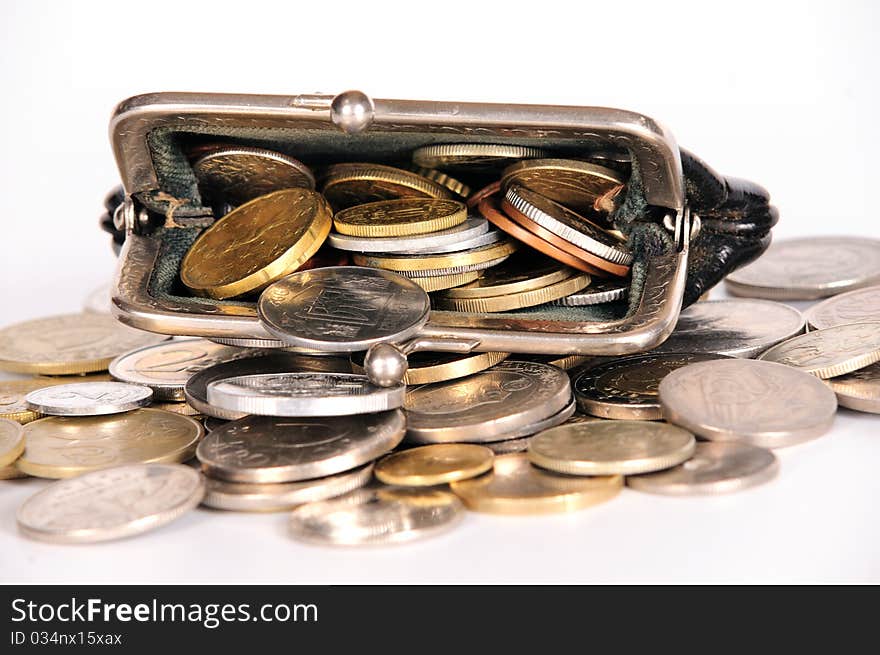 Purse with coins on white isolated background