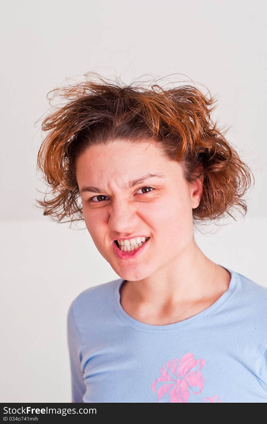 Young woman with a very angry expression on her face. Young woman with a very angry expression on her face