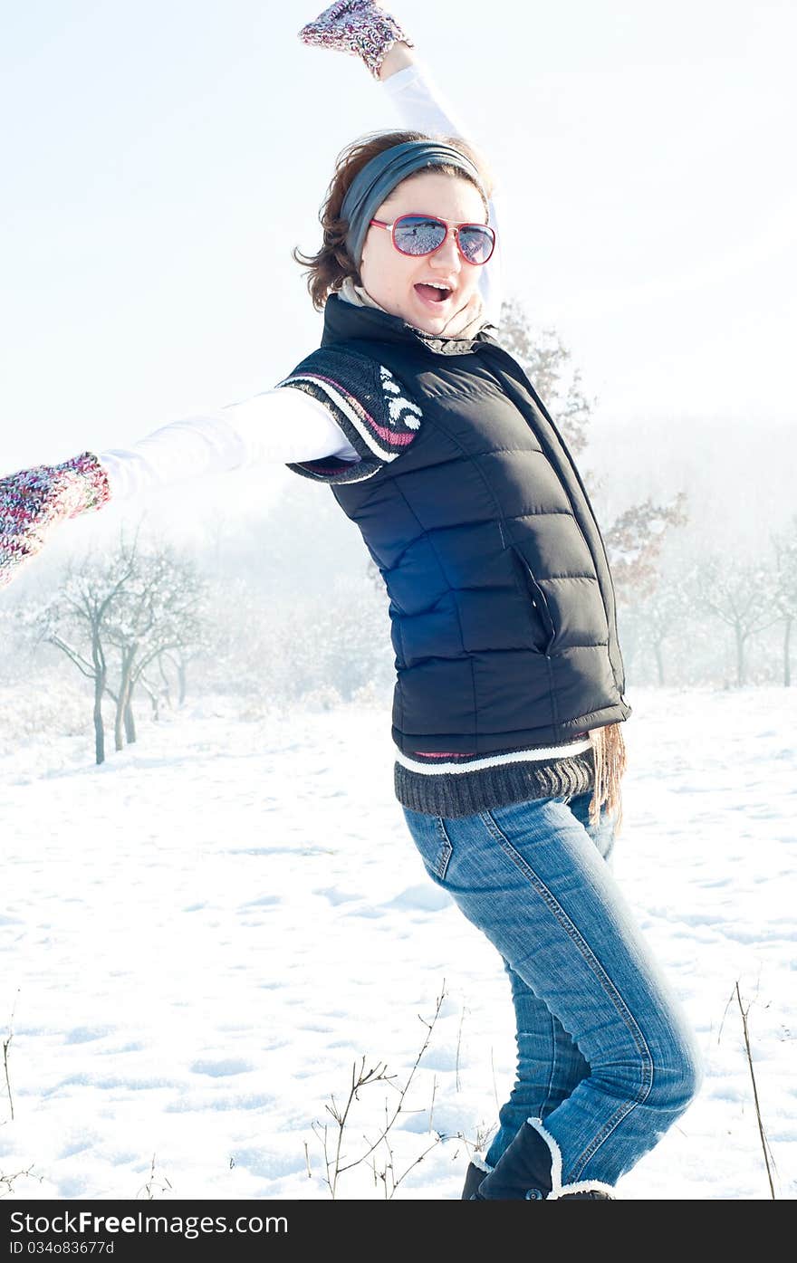 Young woman with red sunglasse in an outdoor winter setting. Young woman with red sunglasse in an outdoor winter setting