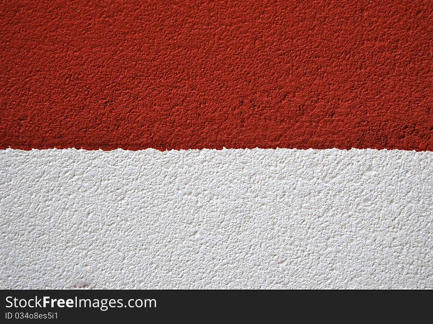 Painted canvas, red and white colors on rough surface. Painted canvas, red and white colors on rough surface