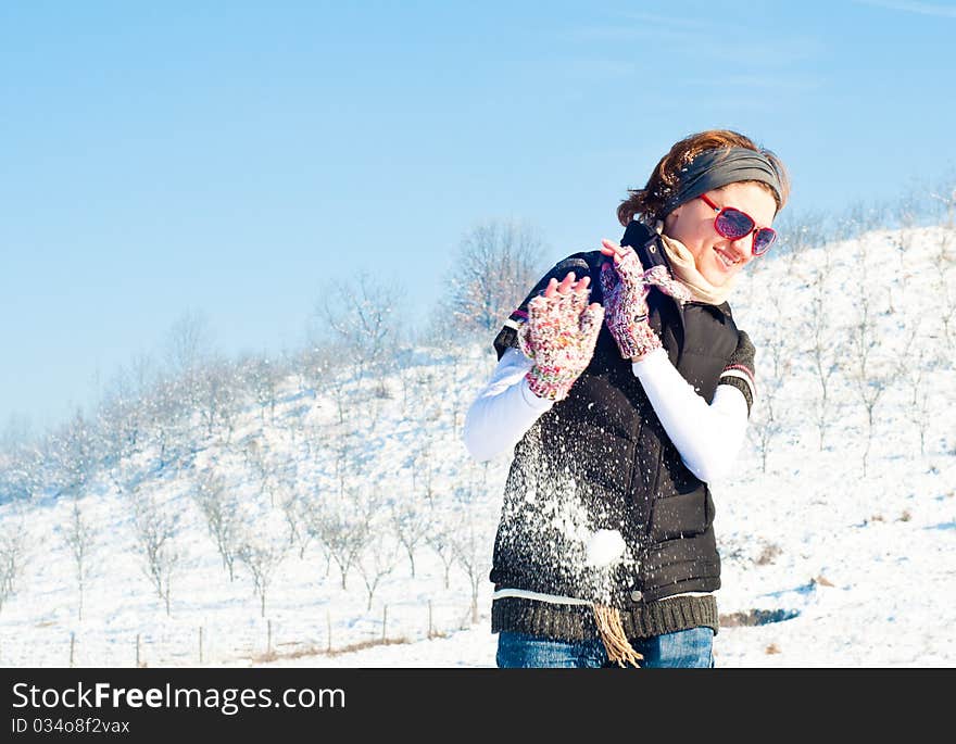 Young woman in a snow fight