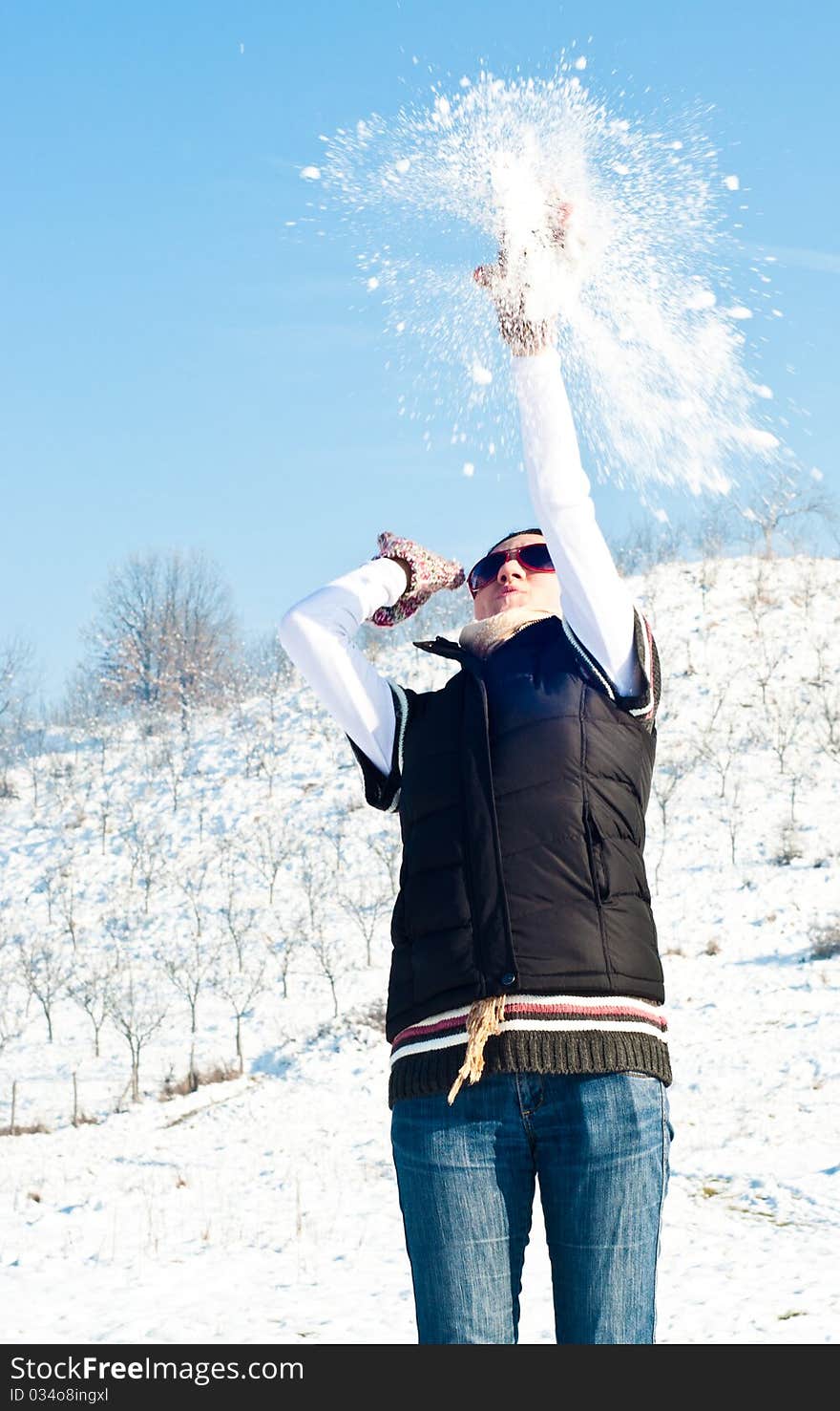 Young woman in a snow fight