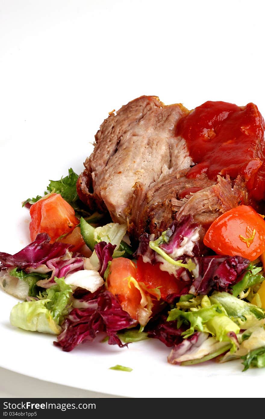 pork roast with salad and potato. pork roast with salad and potato