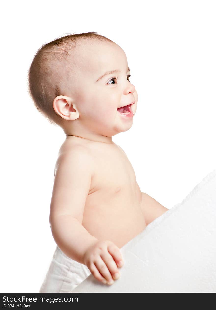 Small beautiful laughing baby girl on a white background