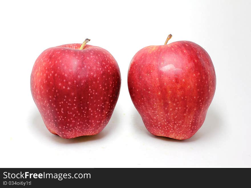 A pair of red fresh apples. A pair of red fresh apples