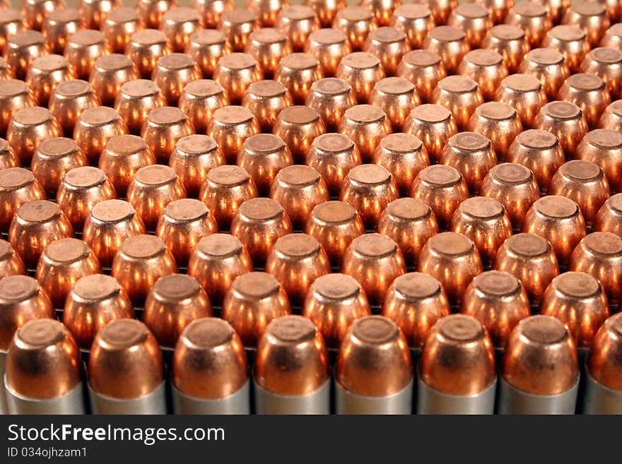 Rows of 40 caliber pistol bullets. Rows of 40 caliber pistol bullets.