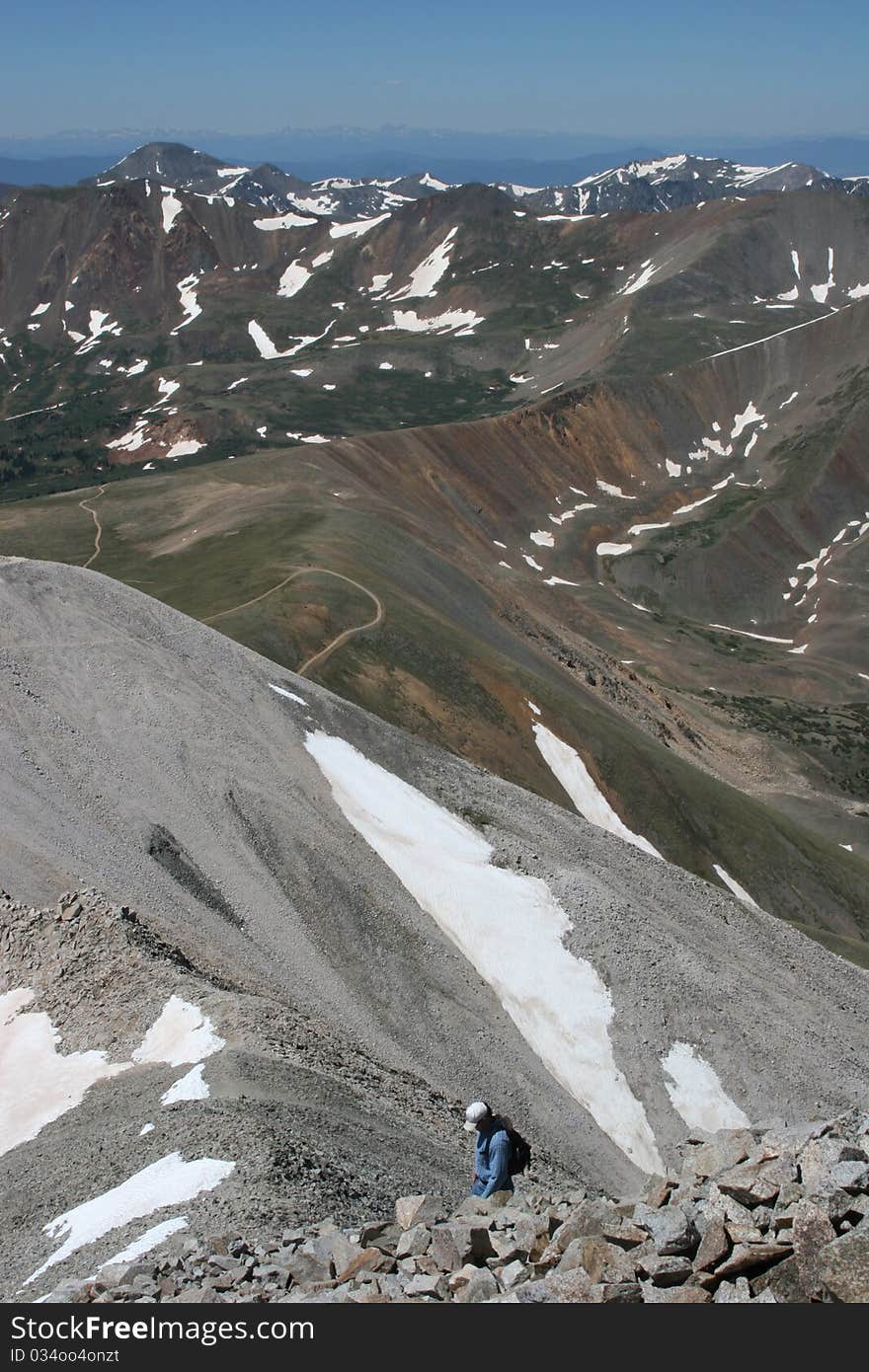 A hiker ascending Mt. Antero, a Colorado fourteener. A hiker ascending Mt. Antero, a Colorado fourteener.