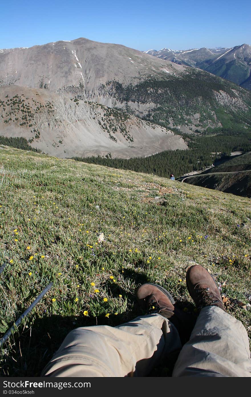 A hiker rests while hiking up Mt. Antero in Colorado. A hiker rests while hiking up Mt. Antero in Colorado