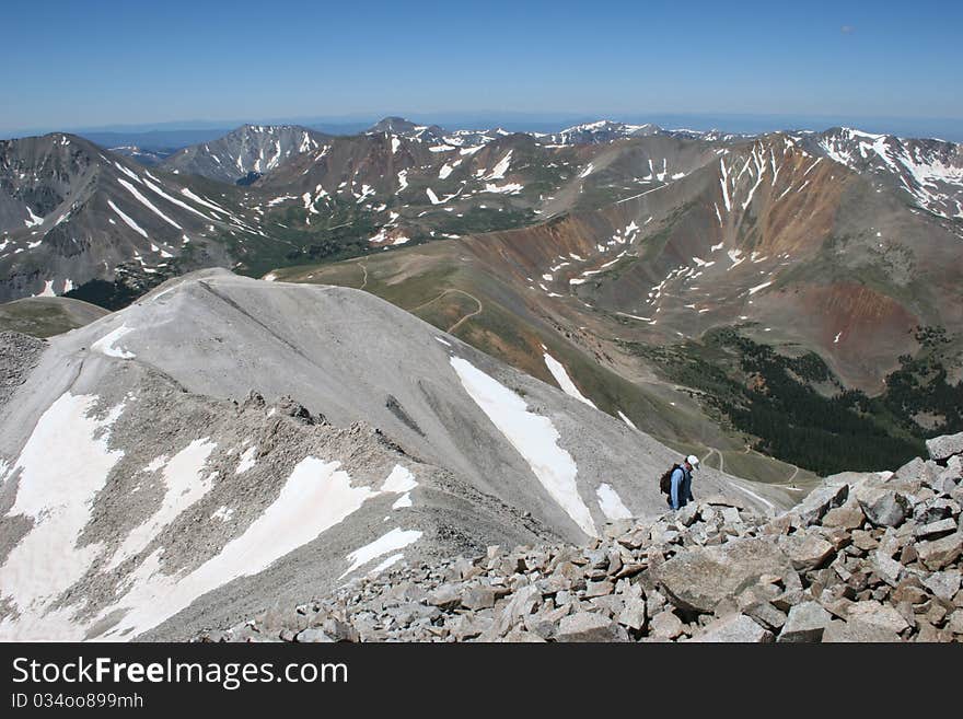 A hiker ascending Mt. Antero, a Colorado fourteener. A hiker ascending Mt. Antero, a Colorado fourteener.