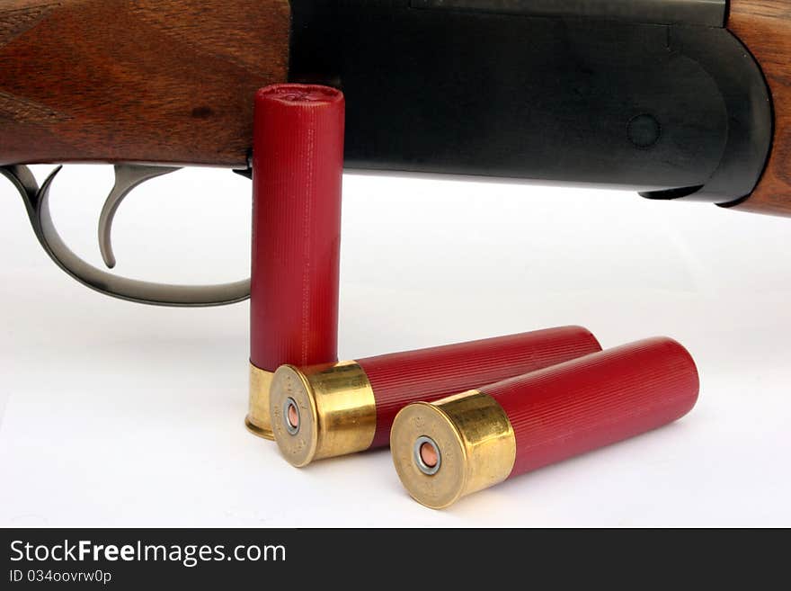 Close up of a double barrel shotgun with shot shells. Close up of a double barrel shotgun with shot shells.