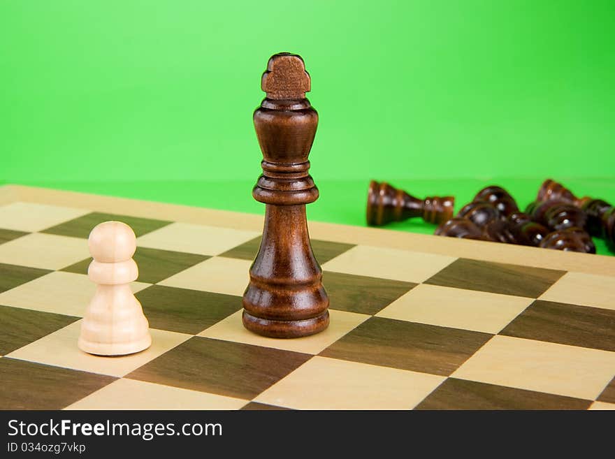 Chess piece isolated on green background. Chess piece isolated on green background