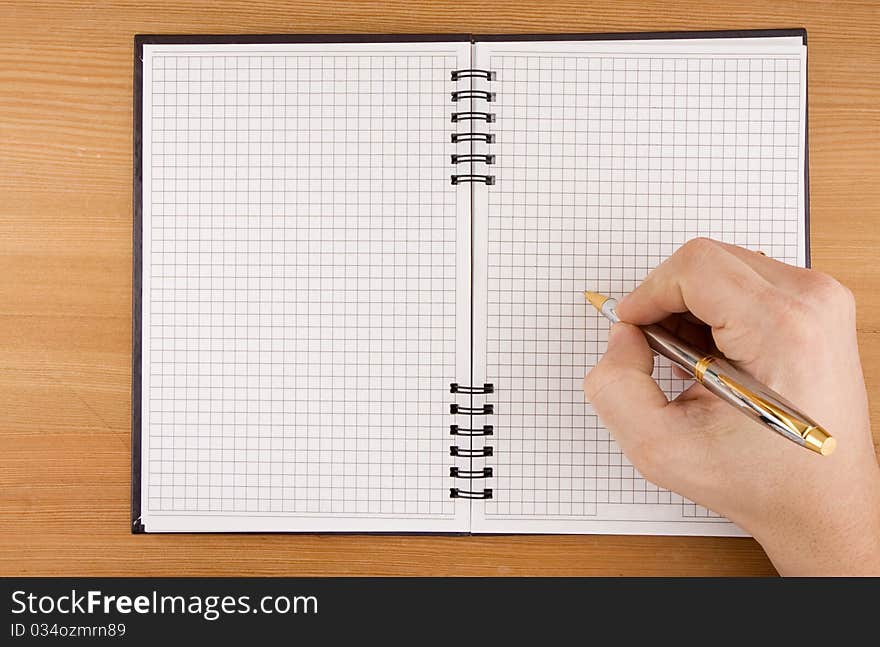 Hand writing by pen on checked notebook. Hand writing by pen on checked notebook