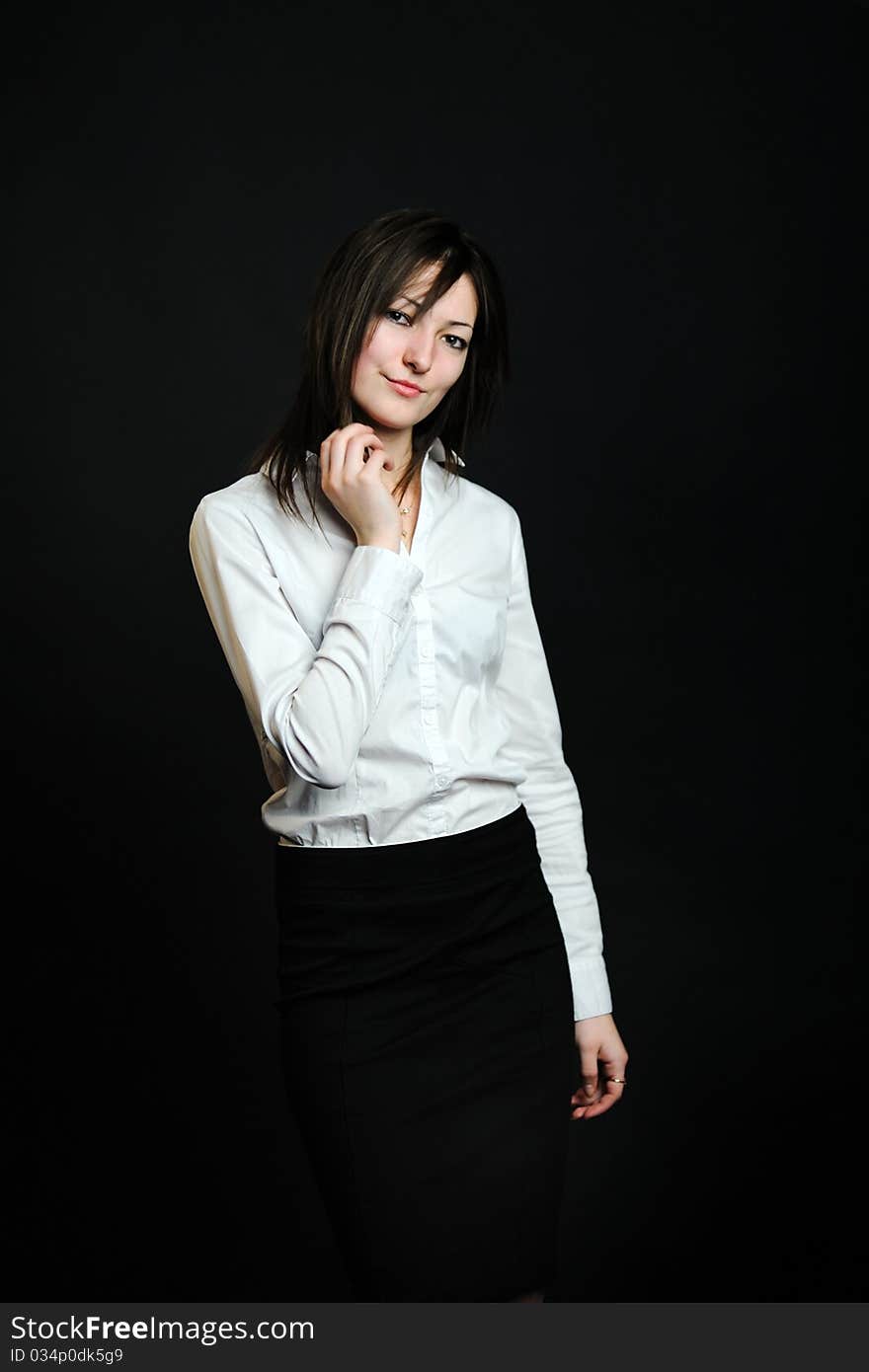 A portrait of a happy young woman on black background. A portrait of a happy young woman on black background