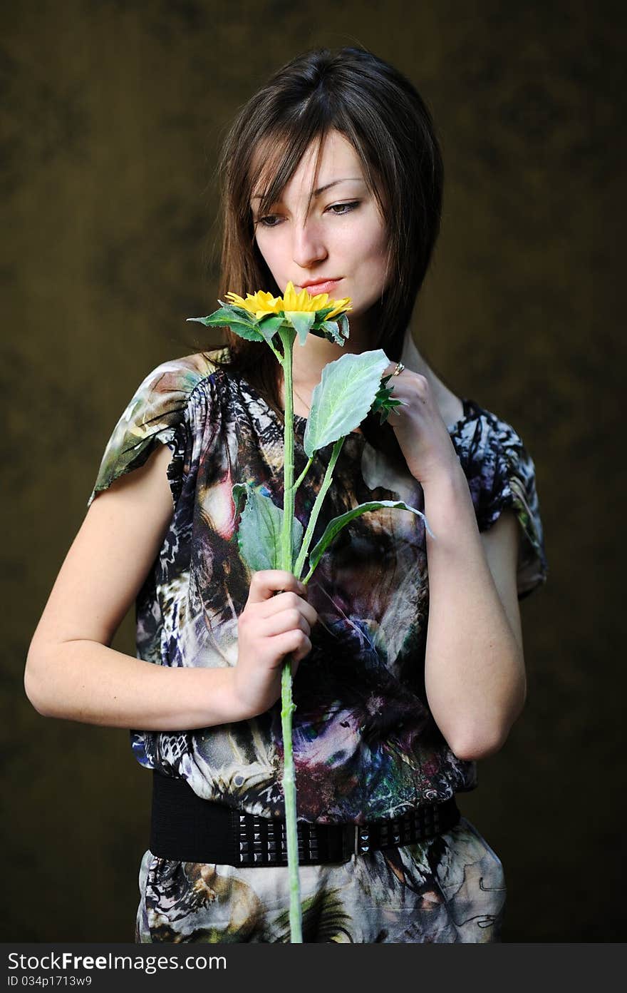 Woman with yellow flower