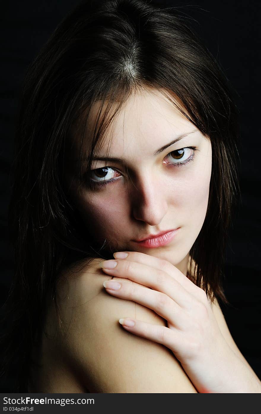 An image of a young beautiful woman close-up. An image of a young beautiful woman close-up