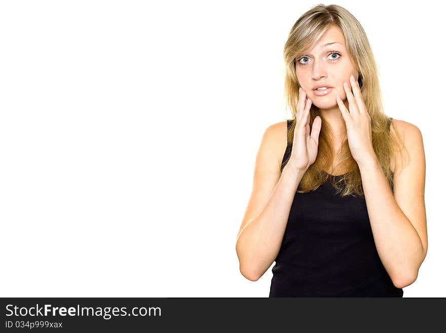 Close-up of a young woman looking surprised. Hands on cheeks. Lots of copyspace and room for text on this isolate. Close-up of a young woman looking surprised. Hands on cheeks. Lots of copyspace and room for text on this isolate