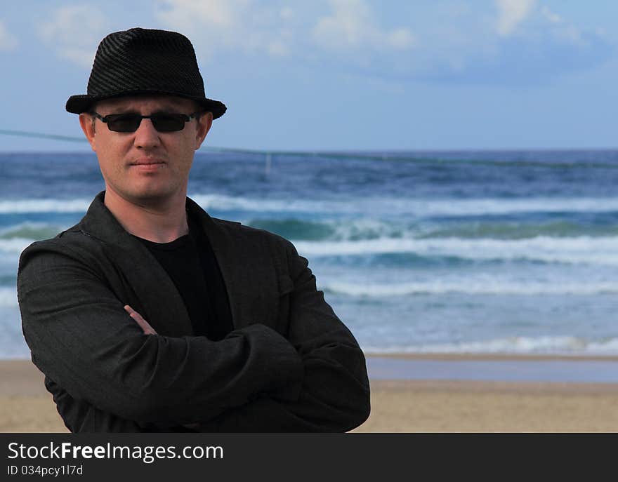 Handsome 30-year-old man in a hat at sea. Handsome 30-year-old man in a hat at sea