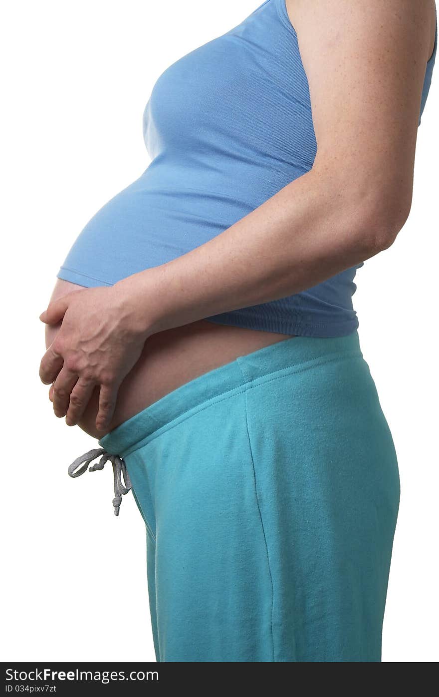 Pregnant woman profile with hands on the stomach over white background. Pregnant woman profile with hands on the stomach over white background