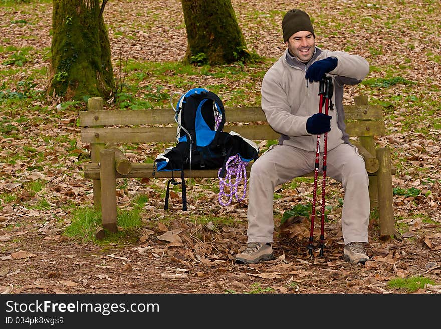 Hiker resting on bench