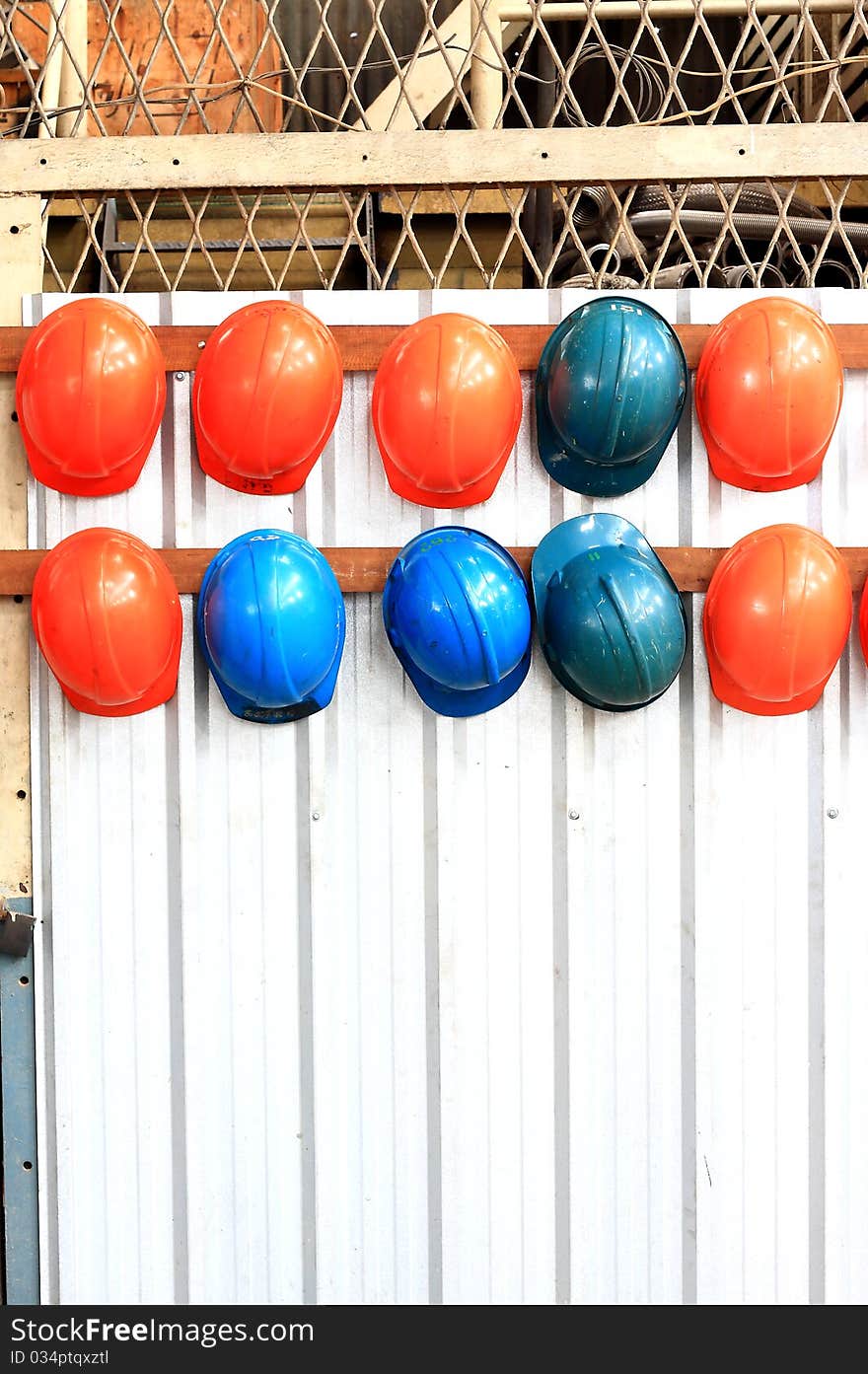 Colorful Hard Hats laying on each others. Colorful Hard Hats laying on each others