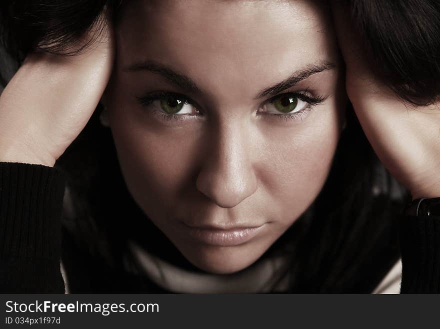 Adorable thoughtful brunette with green eyes