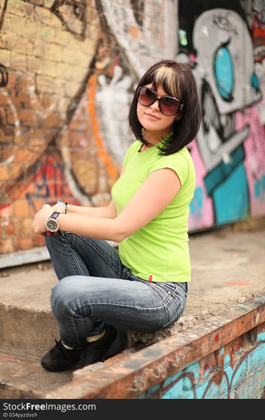 Young attractive girl sitting on stairs. Young attractive girl sitting on stairs