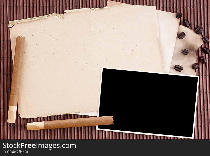 Old tattered sheets of paper on brown wood background for design creativity.