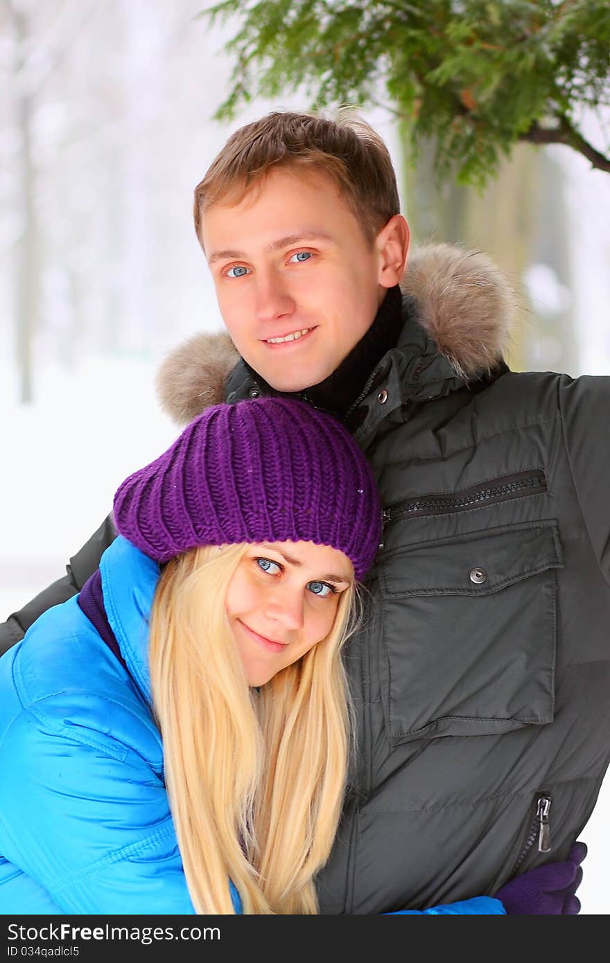 Young adult couple in the park. Winter.