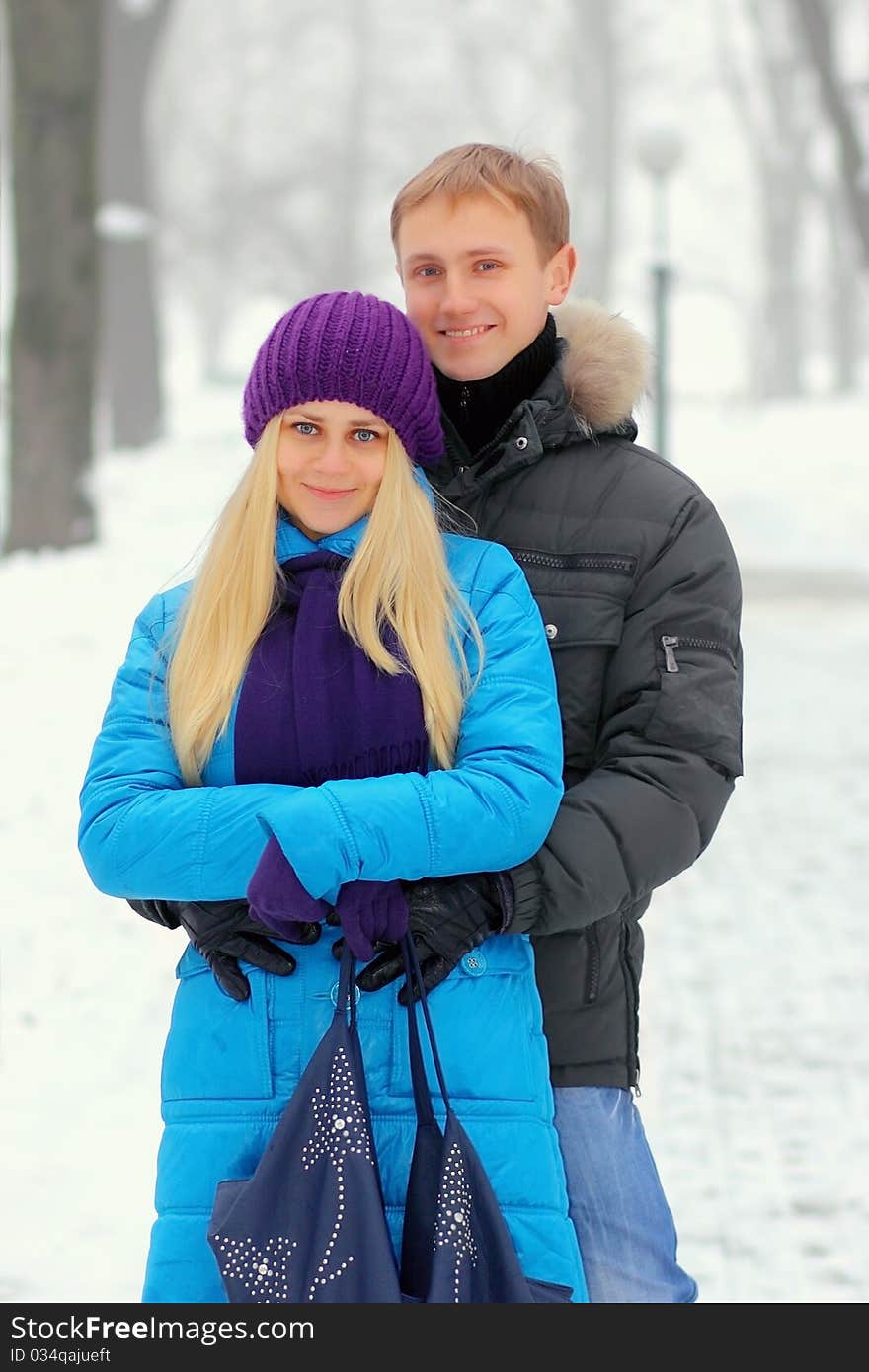 Young adult couple in the park. Winter.