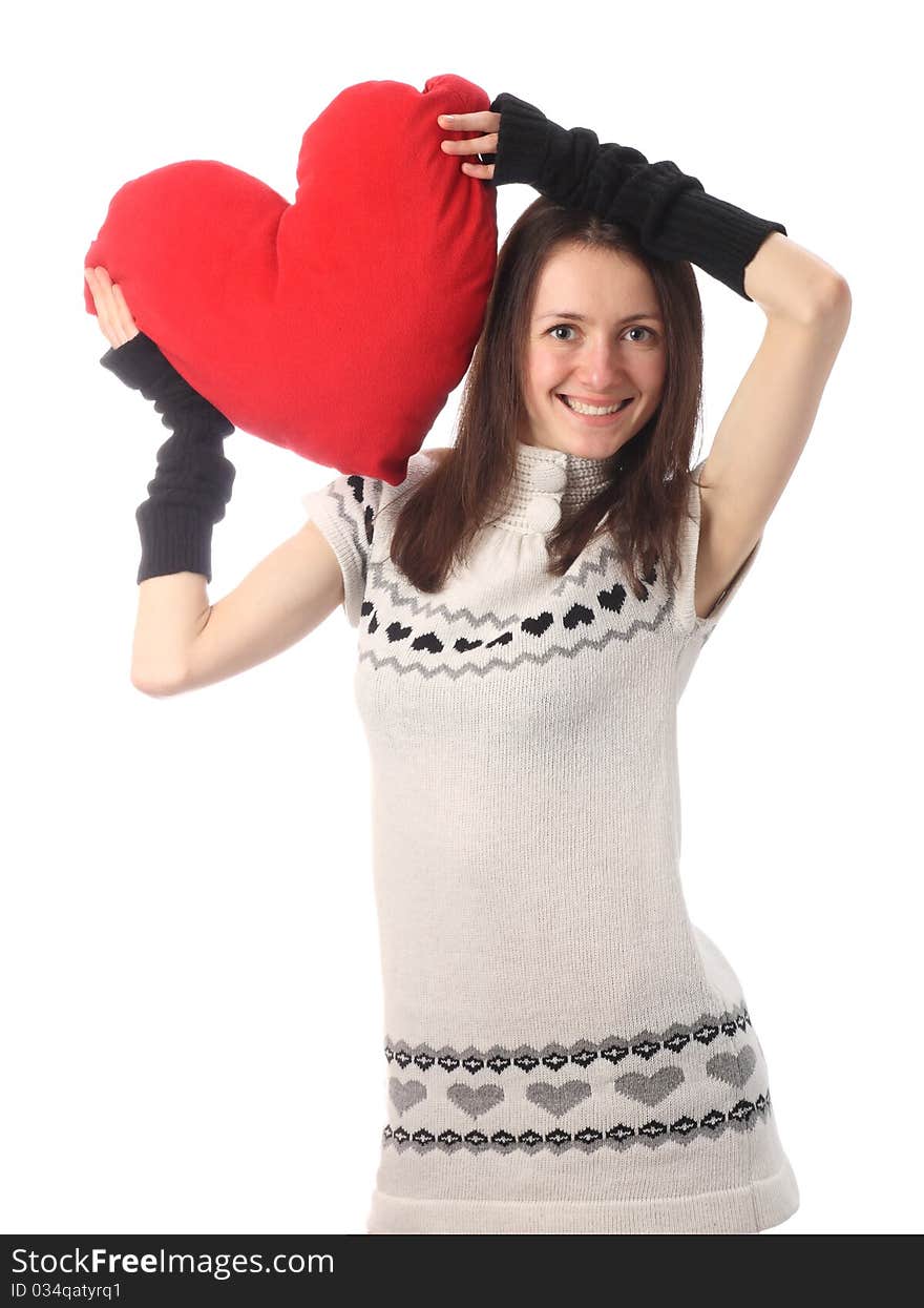 Happy fashionable young woman holding red Valentine's heart and smiling; isolated on white. Happy fashionable young woman holding red Valentine's heart and smiling; isolated on white