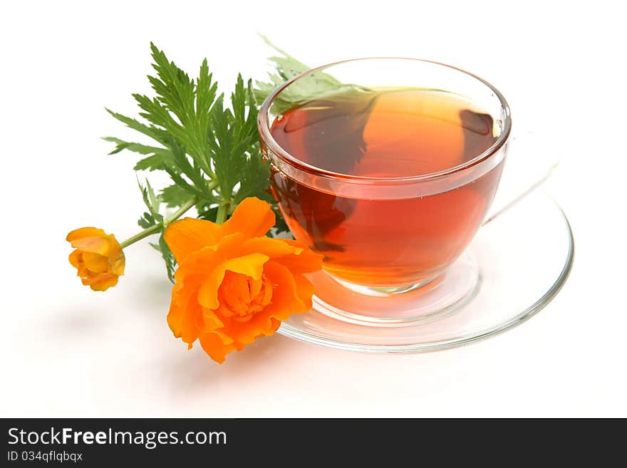 Cup with tea and a flower