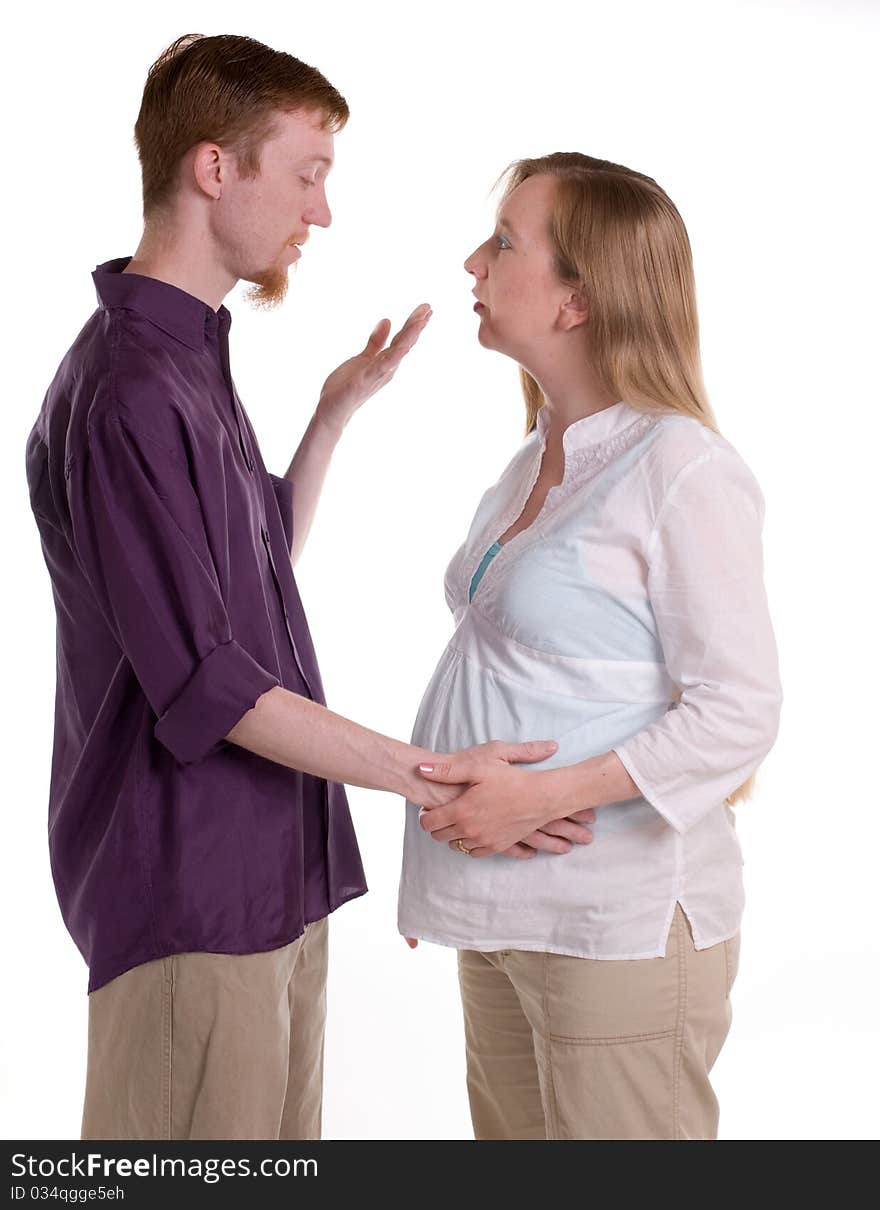 A couple expecting their first baby discussing the future. A couple expecting their first baby discussing the future.