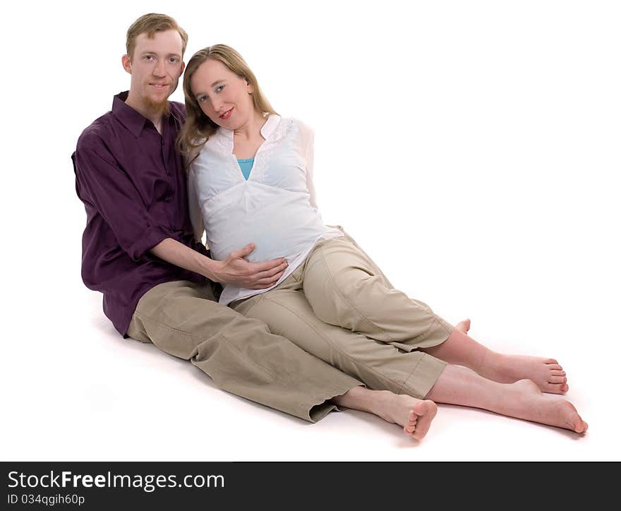 A young couple pregnant with their first child.