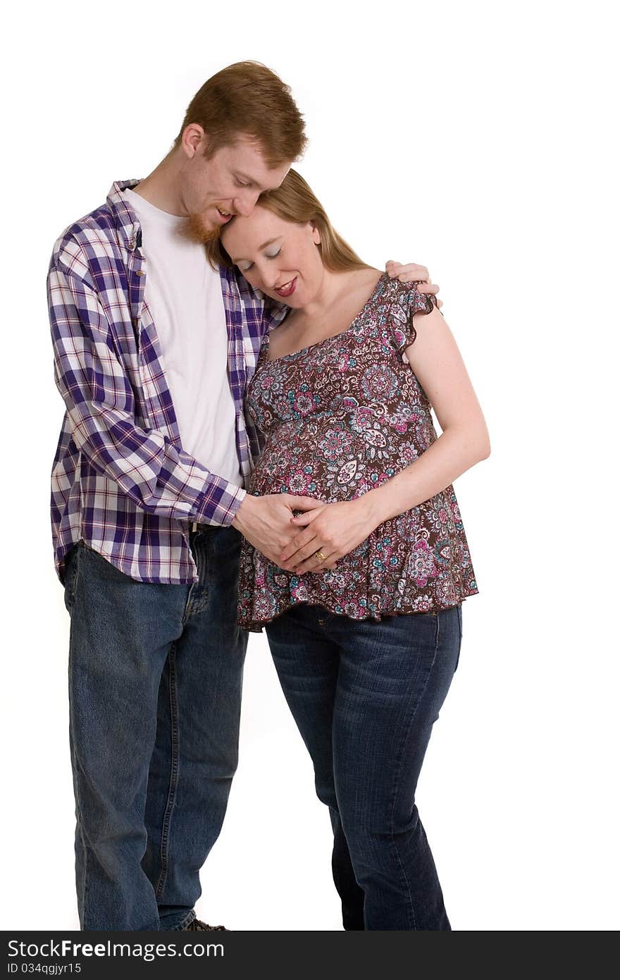 A young couple expecting their first child. A young couple expecting their first child.