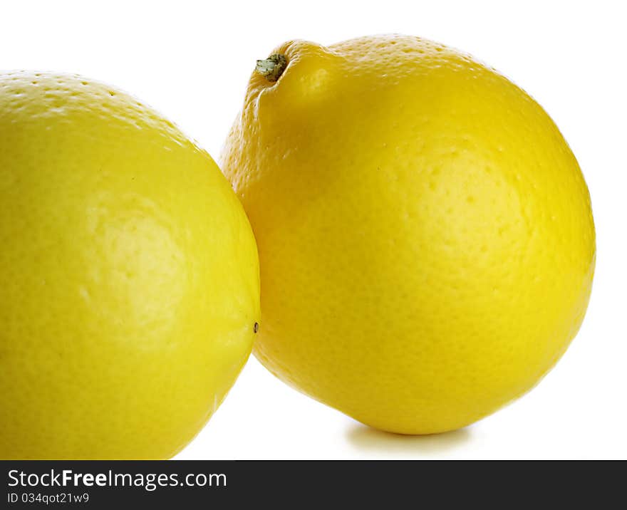 Two lemons isolated on white background