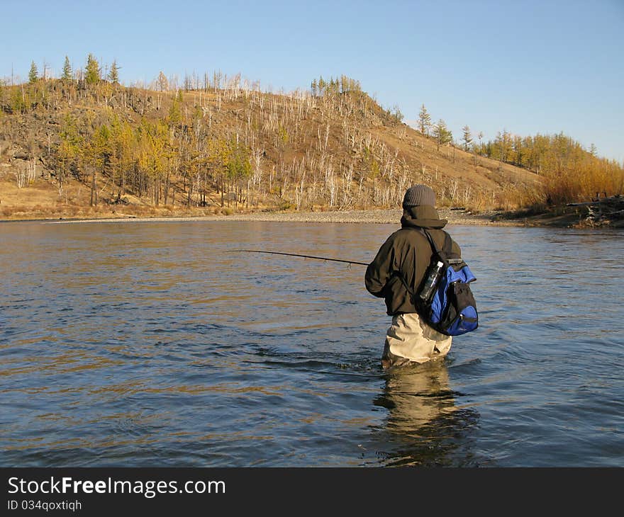 Fishing - fisherman catch fishes on river