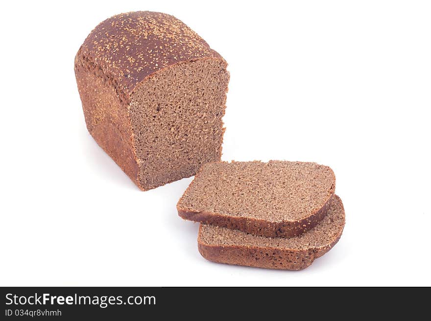 Sliced bread with many seeds isolated on white background.