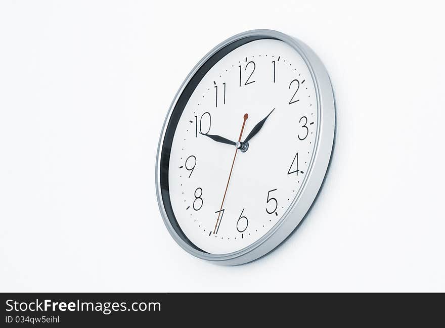 Close up view of clock-face on white back. Close up view of clock-face on white back.