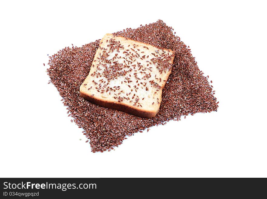 Fibrous food brown bread slice with roassted flax seeds isolated on white background.