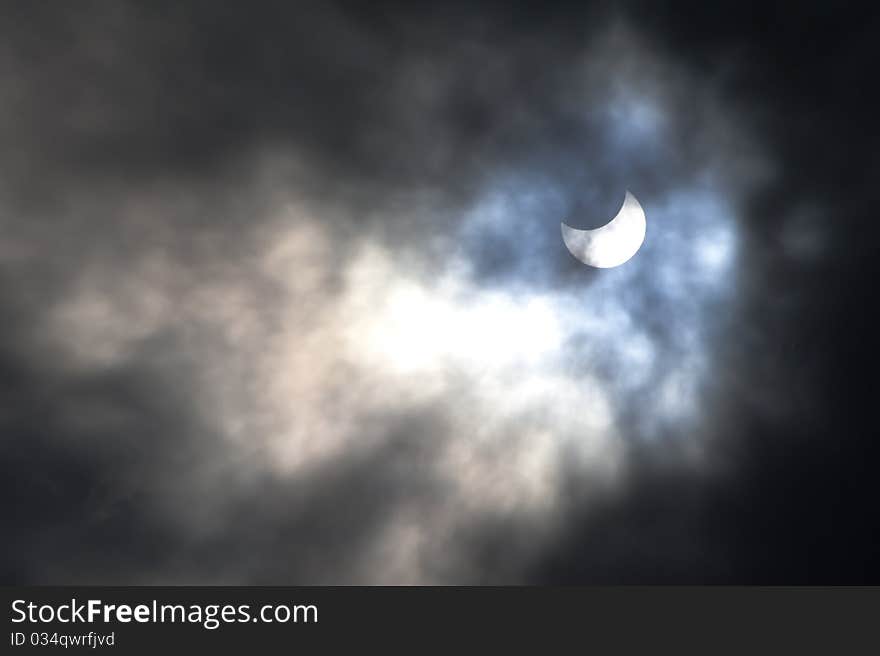 The sun is partially hidden by an eclipse on a cloudy day over Jerusalem. The sun is partially hidden by an eclipse on a cloudy day over Jerusalem.