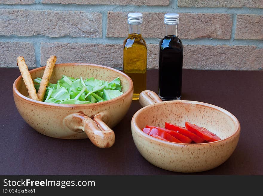 Salad, tomato, oil and vinegar. Salad, tomato, oil and vinegar