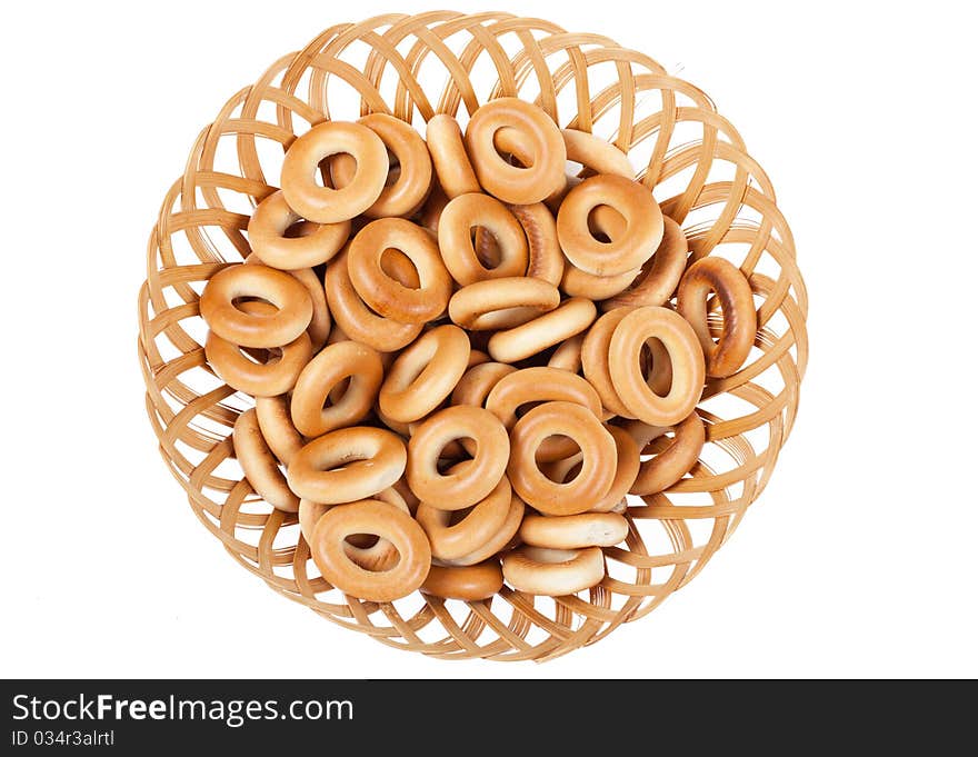 A heap of ring-shaped bread in the basket. A heap of ring-shaped bread in the basket