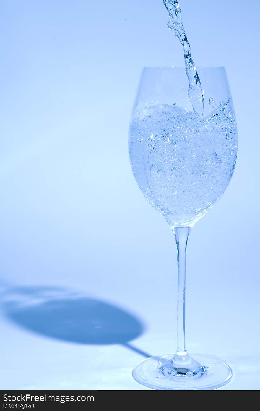 Glass of water isoladed on blue